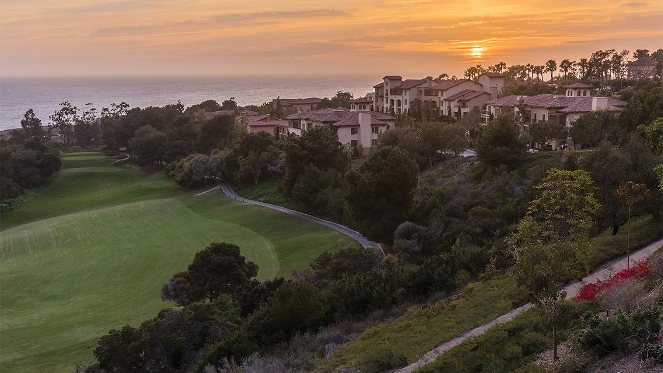 Exterior of Marriott's Newport Coast Villas resort timeshare with sun setting over water